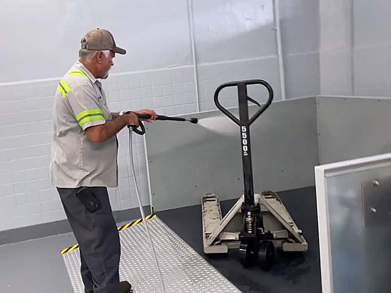 Employee Washing in a Wash Pad Producing Wash Water