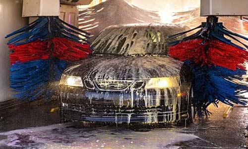 Car Going Through Wash With Water and Oil Draining Needing Separation